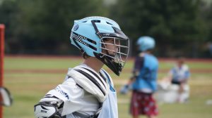 Lacrosse team player paused in the middle of a game
